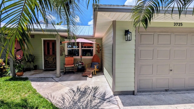 3725 SE Middle St, Stuart, FL 34997 - property entrance with a garage