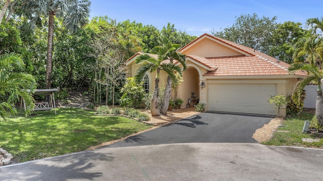 6815 NW 28th St, Margate, FL 33063 - mediterranean / spanish-style home featuring stucco siding, driveway, a garage, a front yard, and a tiled roof