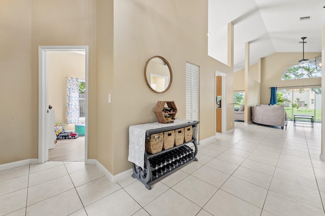 6815 NW 28th St, Margate, FL 33063 - corridor featuring high vaulted ceiling, light tile patterned floors, and baseboards