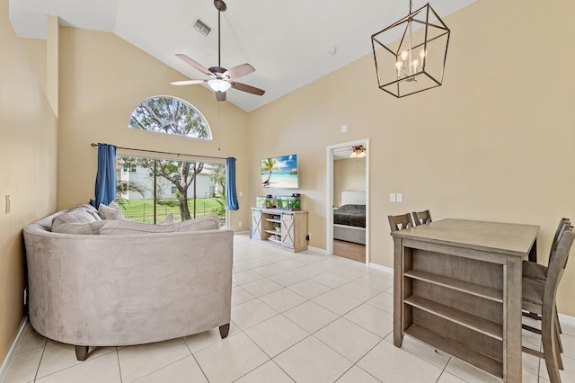 6815 NW 28th St, Margate, FL 33063 - living area with high vaulted ceiling, a ceiling fan, light tile patterned floors, a chandelier, and baseboards
