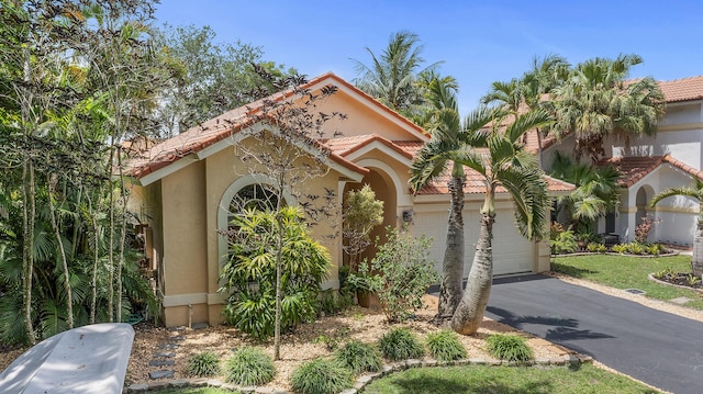 6815 NW 28th St, Margate, FL 33063 - mediterranean / spanish home with driveway, stucco siding, a garage, and a tiled roof