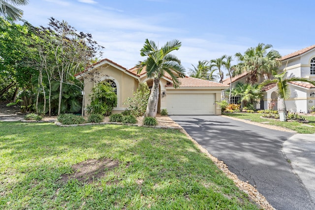 6815 NW 28th St, Margate, FL 33063 - mediterranean / spanish-style house with stucco siding, driveway, a garage, and a front yard