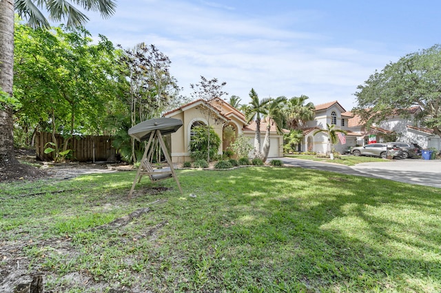 6815 NW 28th St, Margate, FL 33063 - view of front of house with a garage, stucco siding, and asphalt driveway