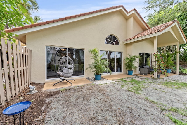 6815 NW 28th St, Margate, FL 33063 - rear view of property featuring stucco siding, a patio, and a tile roof