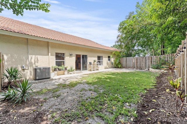 6815 NW 28th St, Margate, FL 33063 - fenced backyard featuring central air condition unit and a patio