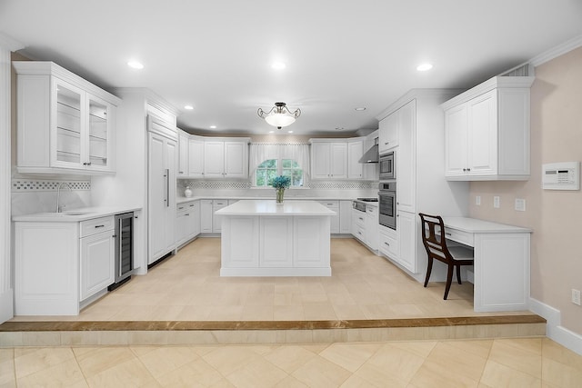 434 NW 7th Ave, Boca Raton, FL 33486 - kitchen with beverage cooler, light countertops, appliances with stainless steel finishes, tasteful backsplash, and recessed lighting