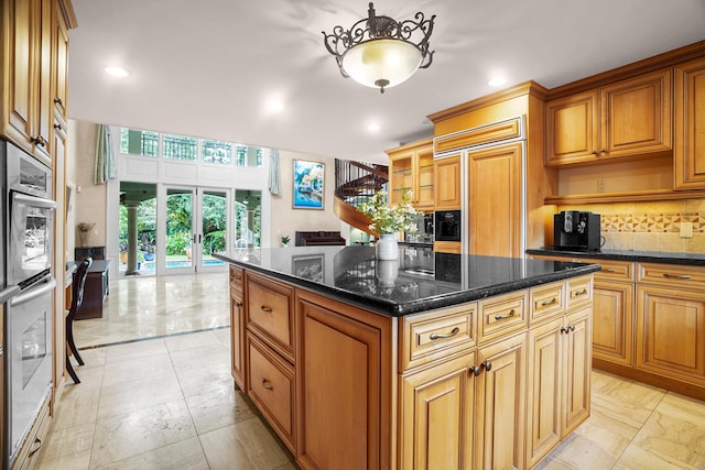 434 NW 7th Ave, Boca Raton, FL 33486 - kitchen with paneled refrigerator, backsplash, open shelves, a center island, and recessed lighting