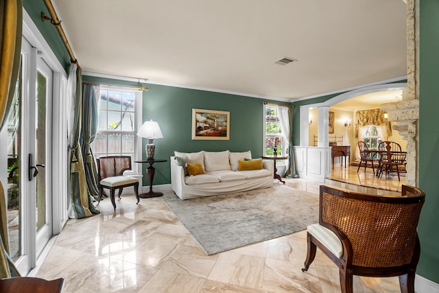 434 NW 7th Ave, Boca Raton, FL 33486 - living room with arched walkways, ornamental molding, healthy amount of natural light, marble tiled floors, and ornate columns