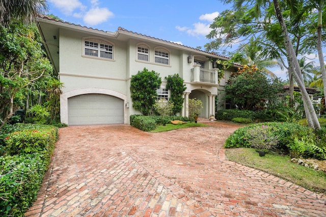 434 NW 7th Ave, Boca Raton, FL 33486 - mediterranean / spanish home featuring a balcony, stucco siding, decorative driveway, and a garage