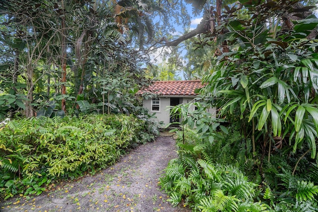 434 NW 7th Ave, Boca Raton, FL 33486 - view of side of property featuring a tiled roof