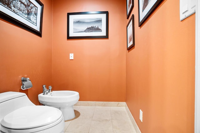 434 NW 7th Ave, Boca Raton, FL 33486 - bathroom with toilet, a bidet, and baseboards