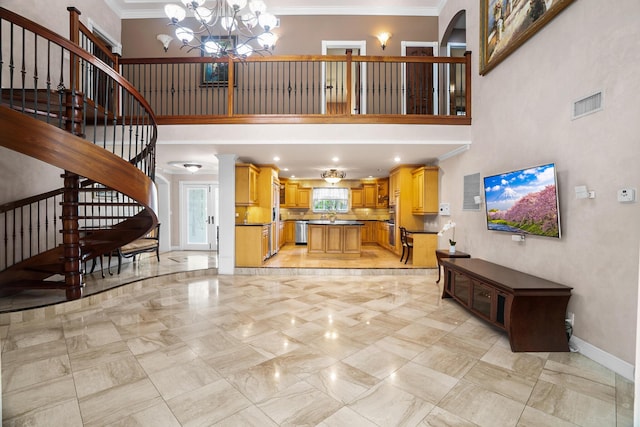 434 NW 7th Ave, Boca Raton, FL 33486 - living area featuring stairs, ornamental molding, a towering ceiling, a chandelier, and baseboards