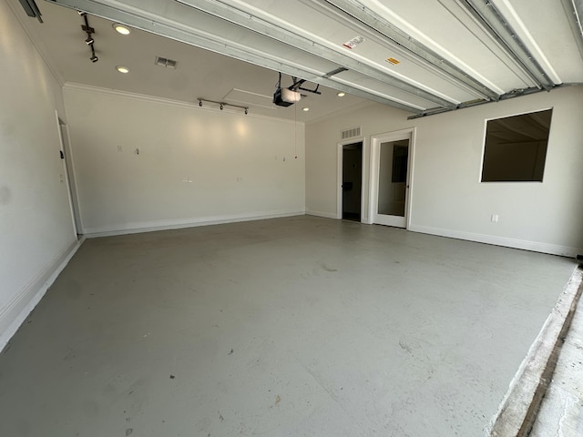 1517 SW Bayshore Blvd, Port Saint Lucie, FL 34983 - garage featuring a garage door opener and baseboards