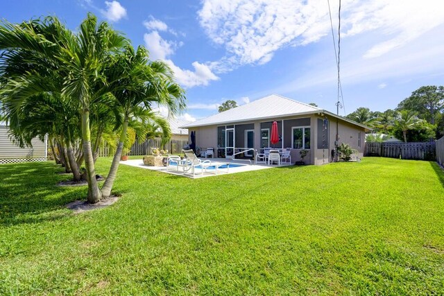 5333 SE Celestial Cir, Stuart, FL 34997 - ranch-style home with stucco siding, a garage, and driveway