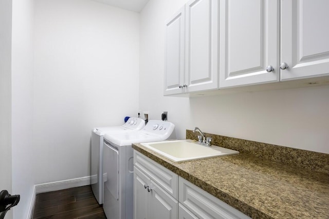 5333 SE Celestial Cir, Stuart, FL 34997 - laundry room with washing machine and clothes dryer, cabinet space, and dark wood finished floors