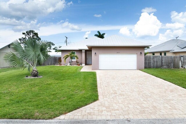 5333 SE Celestial Cir, Stuart, FL 34997 - fenced backyard with a storage shed and a patio