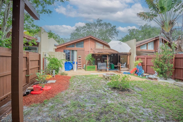 6160 31st Ter NW, Fort Lauderdale, FL 33309 - fenced backyard featuring a fire pit and a patio area