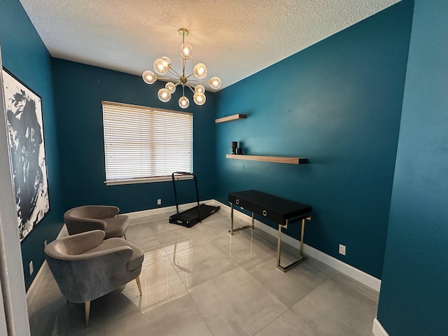 8825 Gibson Cay, West Palm Beach, FL 33411 - living area with a textured ceiling, a chandelier, and baseboards
