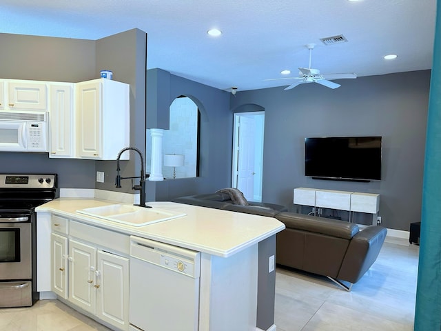 8825 Gibson Cay, West Palm Beach, FL 33411 - kitchen featuring white appliances, a sink, open floor plan, ceiling fan, and white cabinets