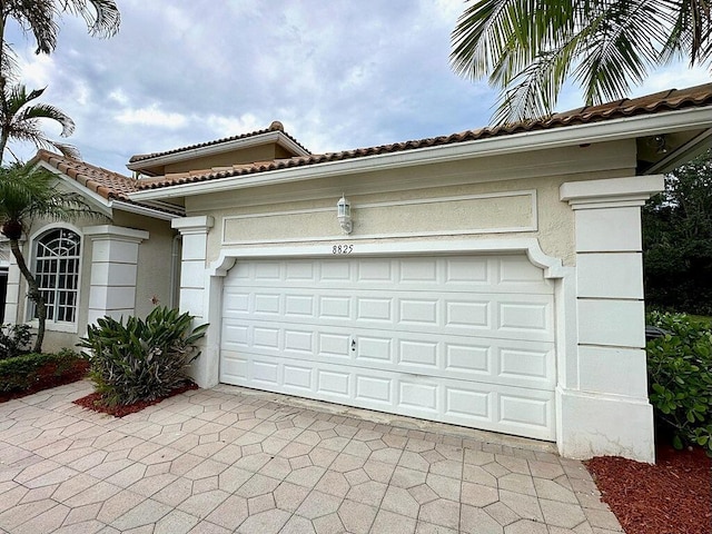 8825 Gibson Cay, West Palm Beach, FL 33411 - garage with driveway