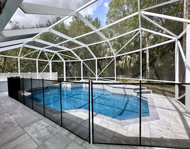 8825 Gibson Cay, West Palm Beach, FL 33411 - view of swimming pool featuring a patio area and a lanai