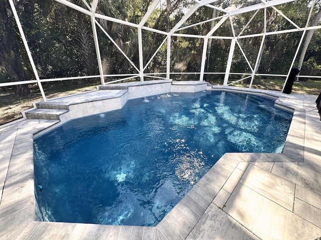 8825 Gibson Cay, West Palm Beach, FL 33411 - swimming pool with glass enclosure and a patio