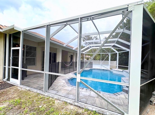 8825 Gibson Cay, West Palm Beach, FL 33411 - view of swimming pool featuring a lanai and a patio area
