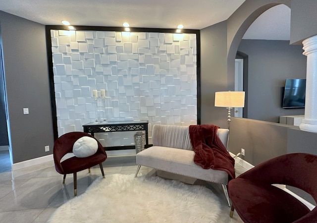 8825 Gibson Cay, West Palm Beach, FL 33411 - living area featuring arched walkways and baseboards