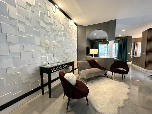 8825 Gibson Cay, West Palm Beach, FL 33411 - sitting room with arched walkways, ornate columns, recessed lighting, and baseboards