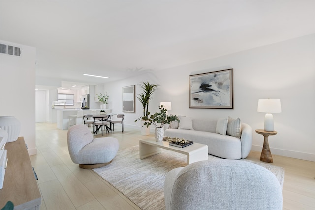 700 NE Harbour Ter Unit 3320, Boca Raton, FL 33431 - living area with light wood-style floors and baseboards