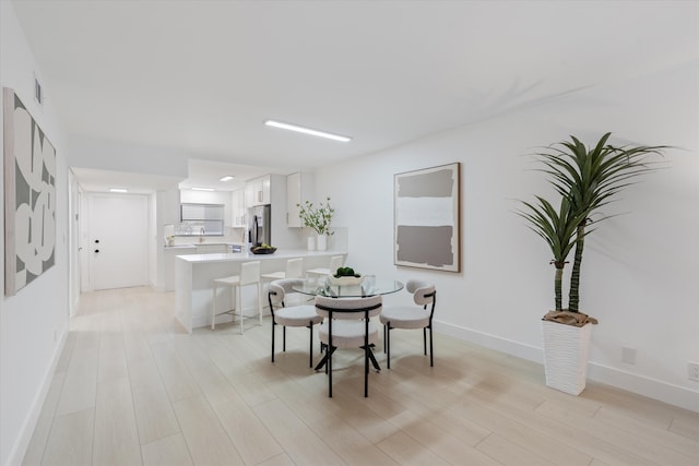 700 NE Harbour Ter Unit 3320, Boca Raton, FL 33431 - dining area with light wood-style floors and baseboards