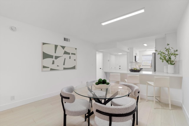 700 NE Harbour Ter Unit 3320, Boca Raton, FL 33431 - dining space featuring light wood-style flooring and baseboards