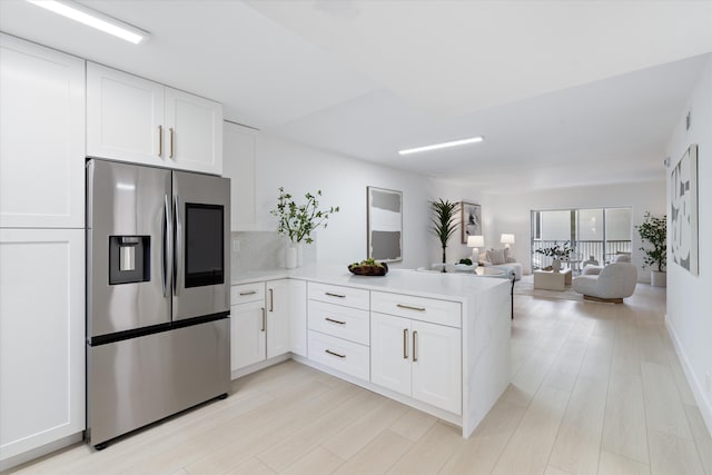 700 NE Harbour Ter Unit 3320, Boca Raton, FL 33431 - kitchen featuring stainless steel fridge, a peninsula, and white cabinets