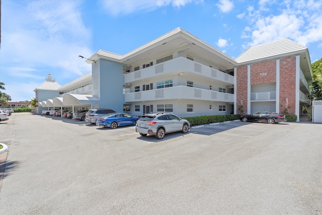 700 NE Harbour Ter Unit 3320, Boca Raton, FL 33431 - view of building exterior with uncovered parking