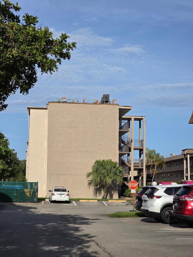 725 Lori Dr Unit 206, Palm Springs, FL 33406 - view of building exterior featuring uncovered parking