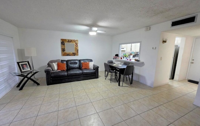 725 Lori Dr Unit 206, Palm Springs, FL 33406 - living room with ceiling fan, a textured ceiling, and light tile patterned floors