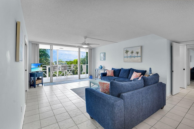 1 Harbourside Dr Unit 4506, Delray Beach, FL 33483 - living room with a wall of windows, a textured ceiling, light tile patterned floors, and ceiling fan