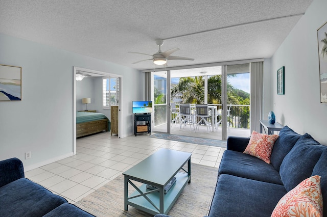 1 Harbourside Dr Unit 4506, Delray Beach, FL 33483 - living room with expansive windows, tile patterned flooring, ceiling fan, a textured ceiling, and baseboards