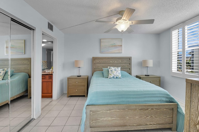 1 Harbourside Dr Unit 4506, Delray Beach, FL 33483 - bedroom featuring a textured ceiling, light tile patterned flooring, and a ceiling fan