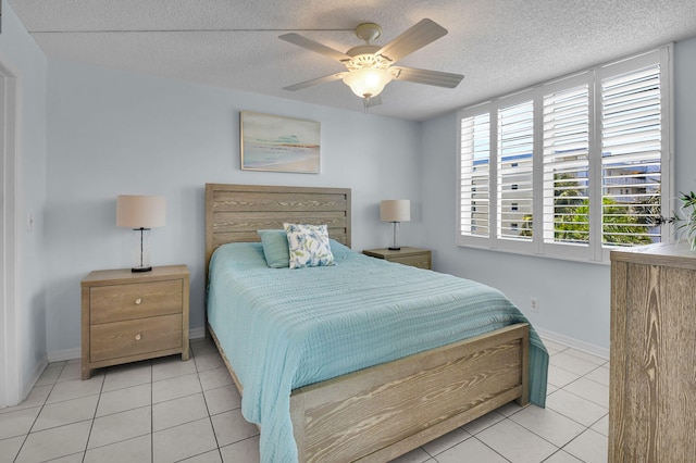 1 Harbourside Dr Unit 4506, Delray Beach, FL 33483 - bedroom with tile patterned flooring, a textured ceiling, a ceiling fan, and baseboards