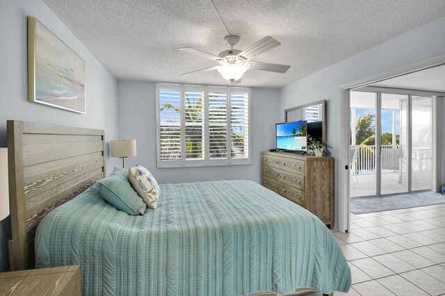 1 Harbourside Dr Unit 4506, Delray Beach, FL 33483 - bedroom with access to exterior, a textured ceiling, tile patterned floors, and a ceiling fan