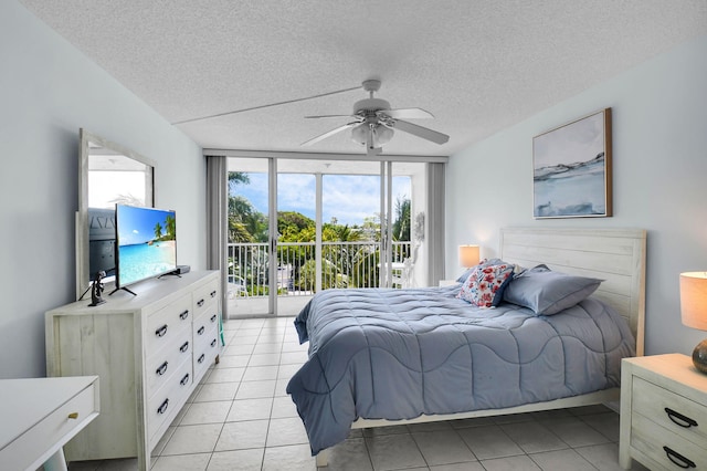 1 Harbourside Dr Unit 4506, Delray Beach, FL 33483 - bedroom with access to outside, a textured ceiling, light tile patterned floors, floor to ceiling windows, and a ceiling fan