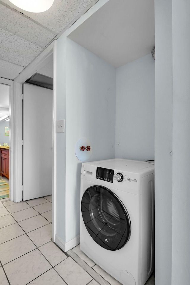 1 Harbourside Dr Unit 4506, Delray Beach, FL 33483 - washroom featuring washer / dryer, baseboards, and light tile patterned floors