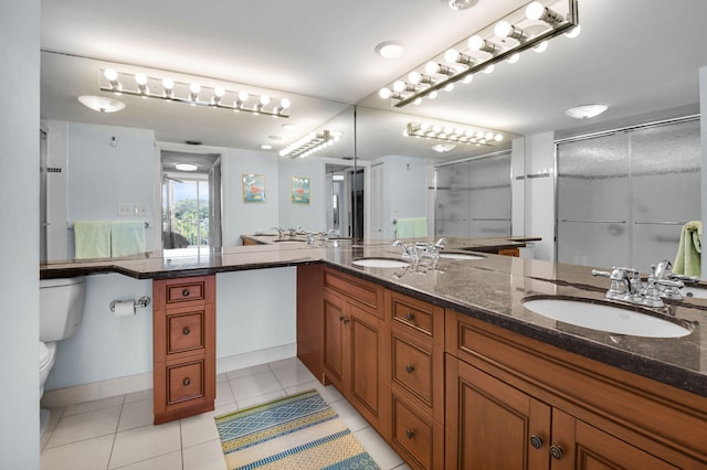 1 Harbourside Dr Unit 4506, Delray Beach, FL 33483 - bathroom featuring double vanity, a shower stall, toilet, and tile patterned flooring