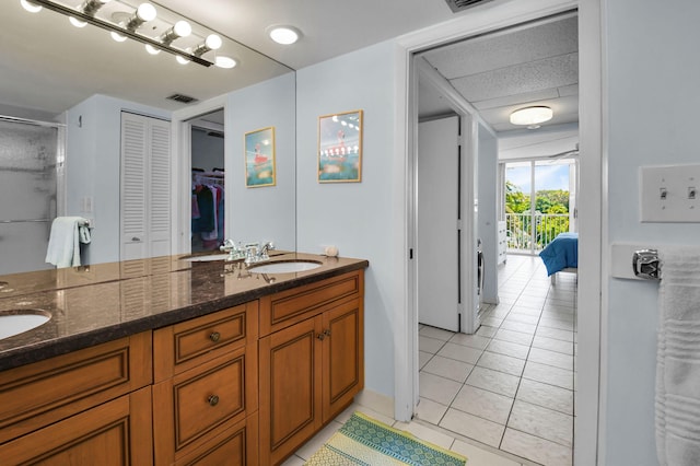 1 Harbourside Dr Unit 4506, Delray Beach, FL 33483 - full bath featuring double vanity, tile patterned floors, and a stall shower
