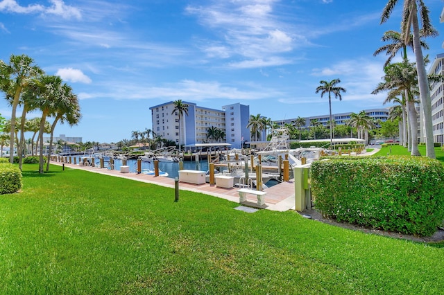 1 Harbourside Dr Unit 4506, Delray Beach, FL 33483 - surrounding community featuring a boat dock, a lawn, and a water view
