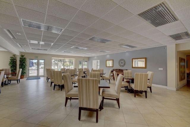 1 Harbourside Dr Unit 4506, Delray Beach, FL 33483 - dining space featuring a paneled ceiling, light tile patterned floors, and baseboards