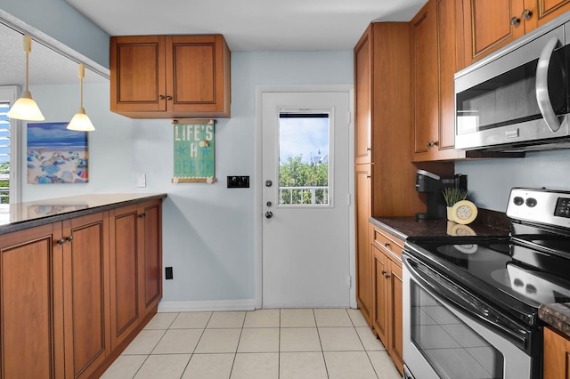 1 Harbourside Dr Unit 4506, Delray Beach, FL 33483 - kitchen featuring stainless steel appliances, brown cabinetry, and dark countertops