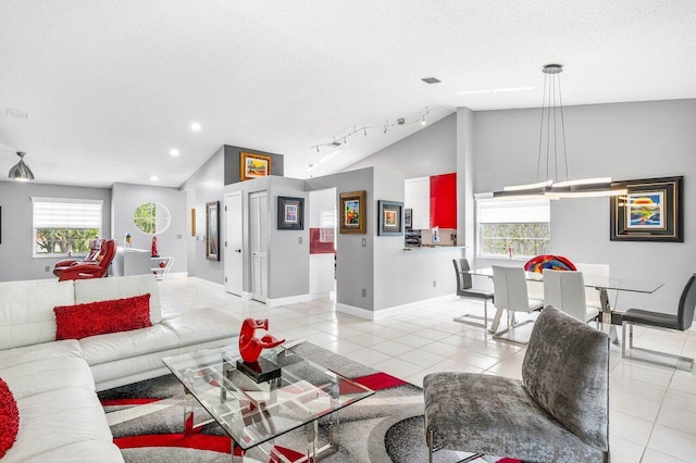 7685 Springwater Pl Unit 201, Boynton Beach, FL 33437 - living room with lofted ceiling, light tile patterned floors, baseboards, a textured ceiling, and recessed lighting