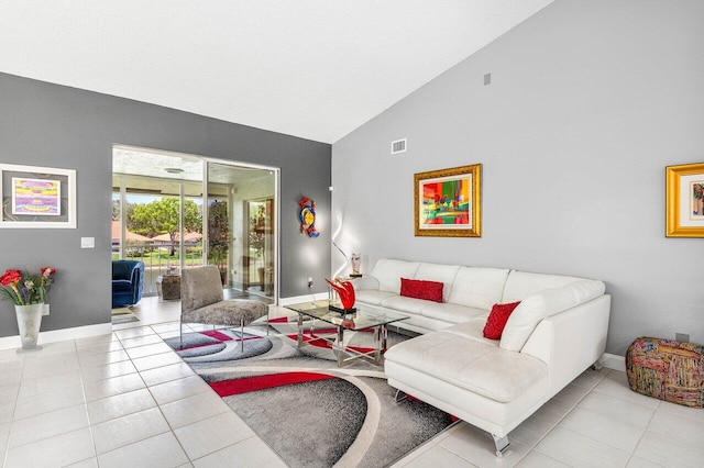 7685 Springwater Pl Unit 201, Boynton Beach, FL 33437 - tiled living area with baseboards and high vaulted ceiling